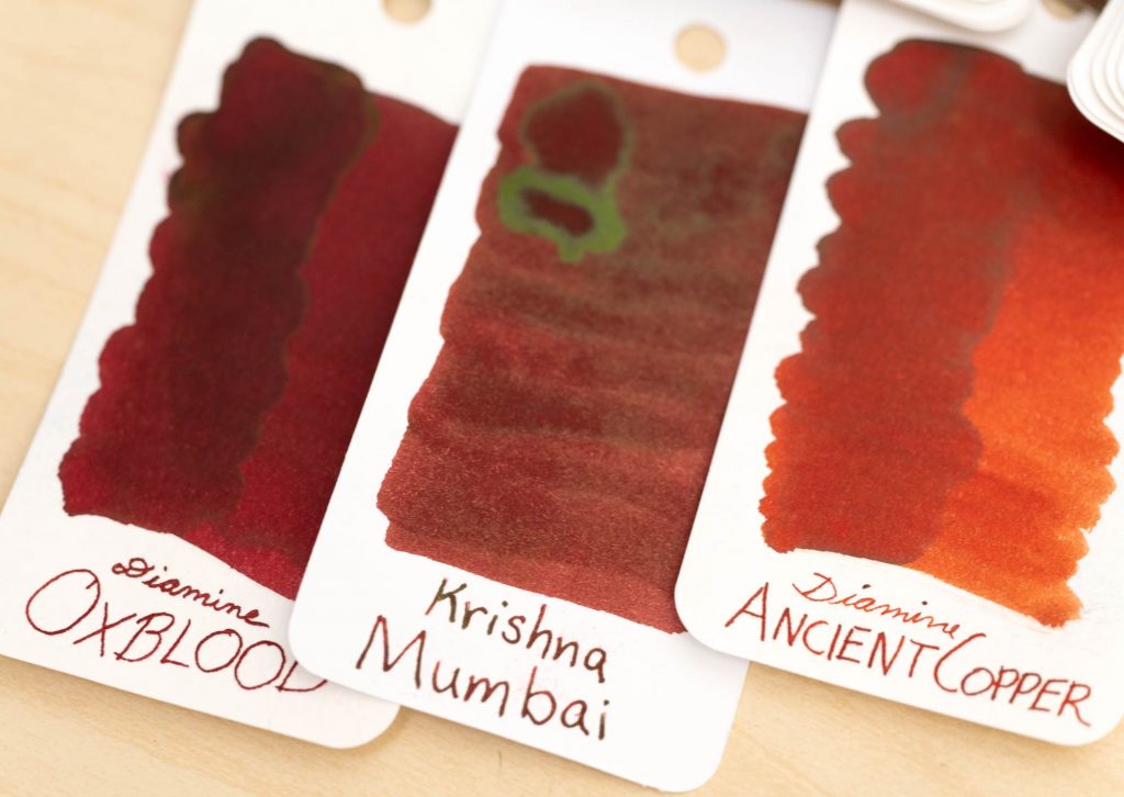 Krishna Mumbai Ink swatch between Diamine Oxblood and Ancient Copper